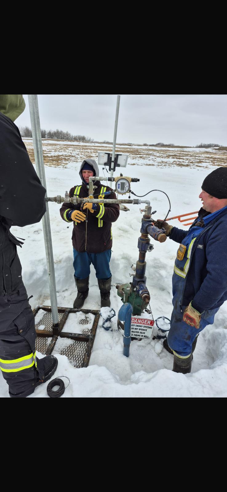 Field measurement team at an Alberta wellsite